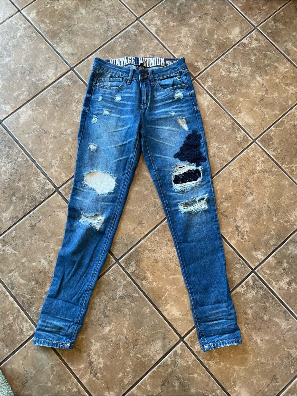 Vintage Reunion Blue Skinny Jeans with Dark Patch Accent size 1